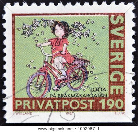 SWEDEN - CIRCA 1987: stamp printed in Sweden shows Girl on bike circa 1987