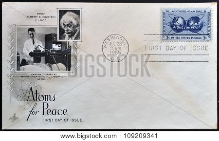 a stamp printed in USA shows Atomic Energy Encircling the Hemispheres Atoms for Peace