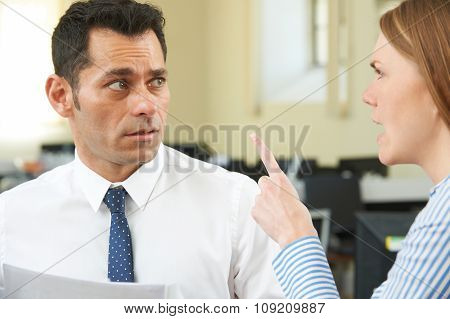 Aggressive Businesswoman Shouting At Male Colleague