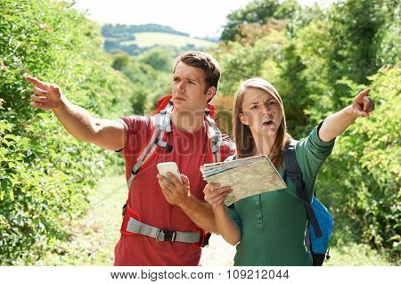 Couple Disagreeing About Best Way To Navigate On Hike
