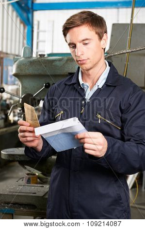 Factory Worker Opening Wage Packet