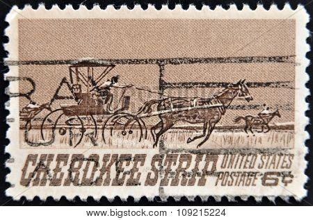 a stamp printed in USA shows Homesteaders Racing to Cherokee Strip