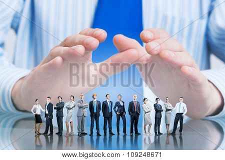 Large group of business people protected with hands 