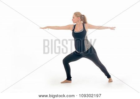 Pregnant woman doing sport exercises in yoga style