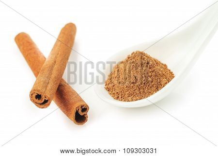 Cinnamon Sticks And Powder On White Background