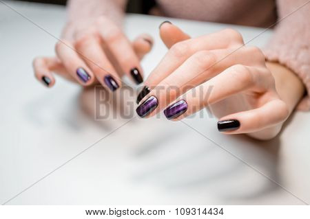 Finished shellac manicure girl in beauty salon