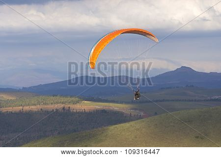 Paragliding Over Hilly Valley