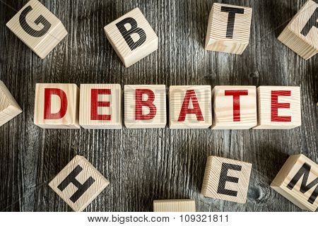 Wooden Blocks with the text: Debate