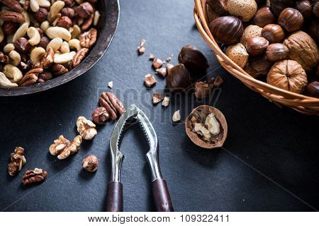 Mixed Nuts In Basket And Nut Cracker From Above