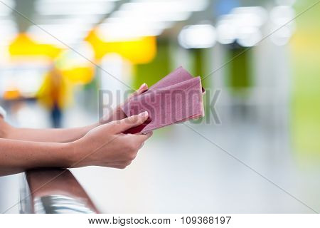 Closeup passports and boarding pass at airport indoor
