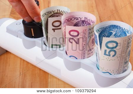 Hand Of Woman Turns Off Electrical Plug, Polish Currency Money, Energy Costs