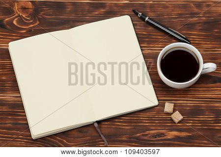 Blank Open Notepad. Cup Of Coffee. Wooden Background