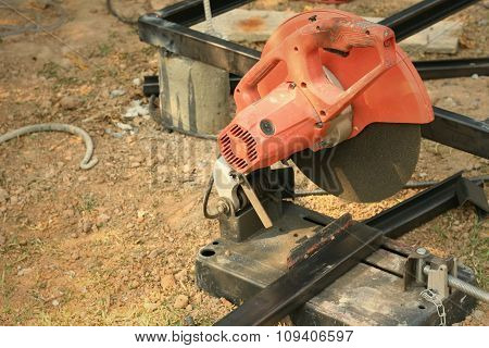 Mechanic Cutting A Steel At The Park