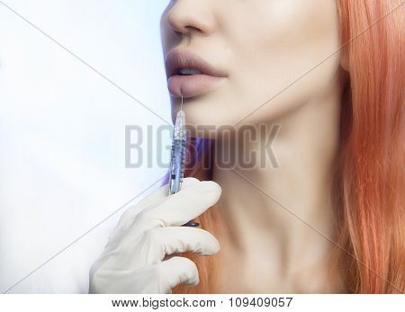 Woman Geting An Injection In Her Lips In Beauty Salon