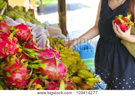Woman Choosing Fruits In The Open Air Fruit Market