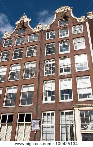 AMSTERDAMNETHERLANDS-APRIL 27: Facade of tipical Amsterdam architecture and appartments on April 27 2015 in Amsterdam Netherlands.