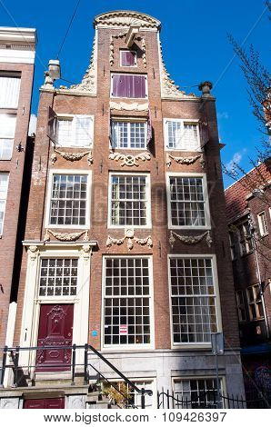 AMSTERDAMNETHERLANDS-APRIL 27: Amsterdam 17th century architecture in down town on April 27 2015 in Amsterdam Netherlands.