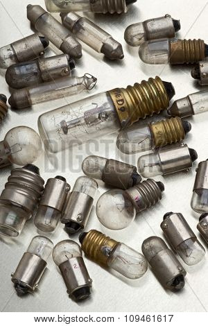 used light bulbs scattered on white