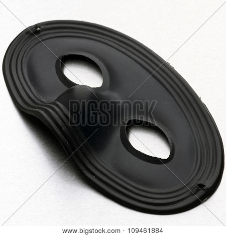black mask on white surface