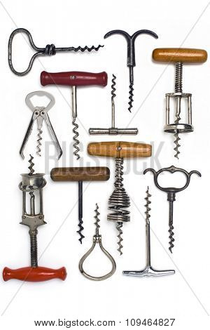 a collection of old corkscrews on white