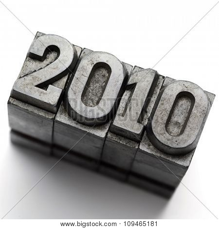 vintage typography lead letters forming 2010 on white
