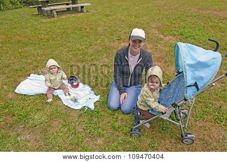 Mom Watching Her Twins In The Park