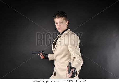 Handsome Man With A Gun Wearing A White Suit