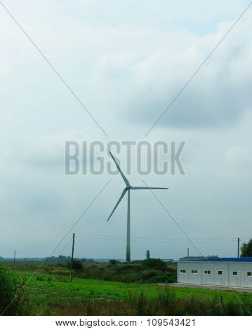 Wind-driven Generator In The Middle Of A Field