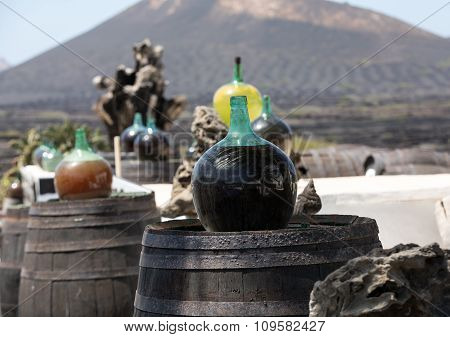 Barrels and big bottles with grape wine - malvasia. Lanzarote Spain