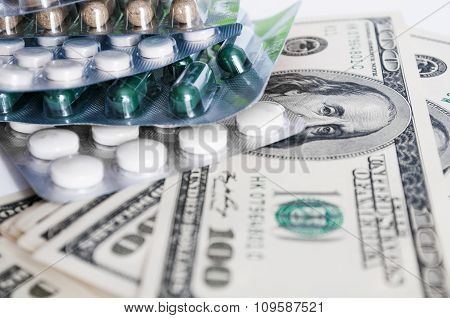 Hundred Dollar Bills And Pills Blisters Close-up
