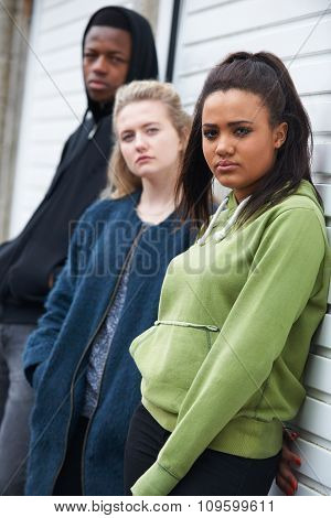 Group Of Teenagers Hanging Out In Urban Environment