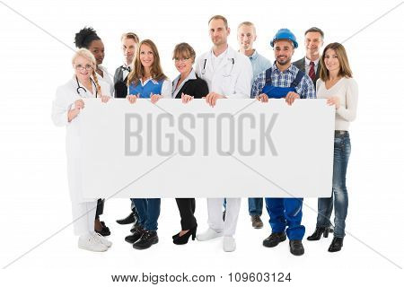 People With Various Occupations Holding Blank Billboard