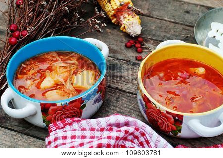 Traditional Ukrainian Russian vegetable borscht on the old wooden background. Ukrainian and russian