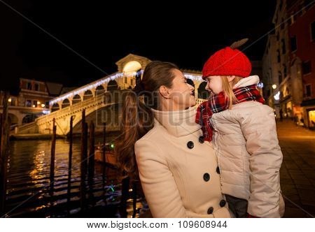 Happy Mother And Daughter Near Rialto Bridge In Christmas Venice