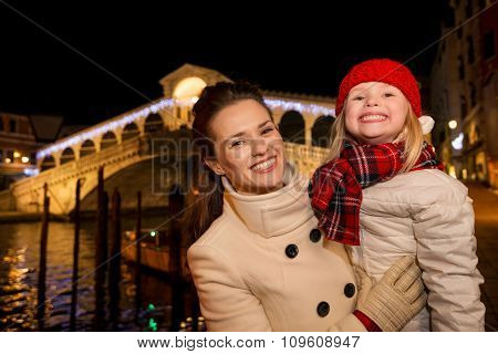Happy Mother And Daughter Near Rialto Bridge In Christmas Venice