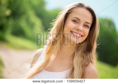 Smiling.
