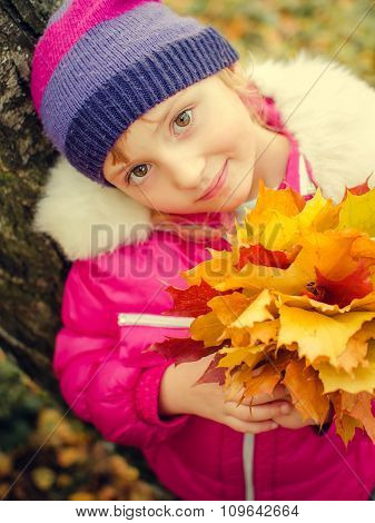 Little Girl With Autumn Orange Leaves