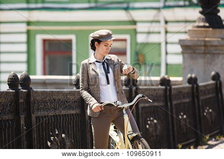 Young Woman At Vintage Bicycle British Style