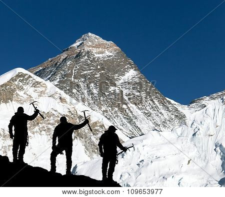 Mount Everest And Silhouette Of Climbing Men