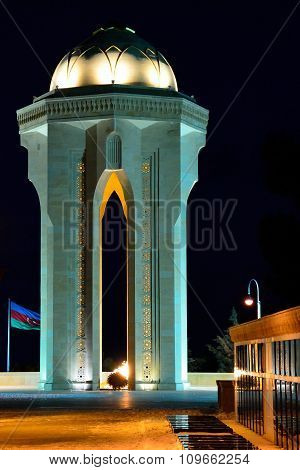 20th January Monument in front of Azerbaijani Flag at night