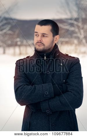 Skeptical Man Outside in Snowing Winter Decor