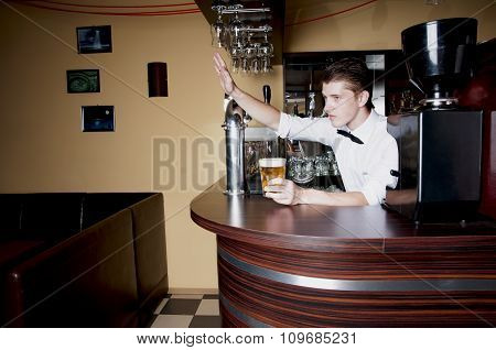 Young Handsome Bartender Waiting An Order.