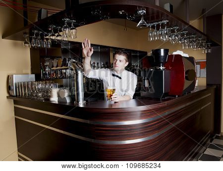 Young Handsome Bartender Waiting An Order.
