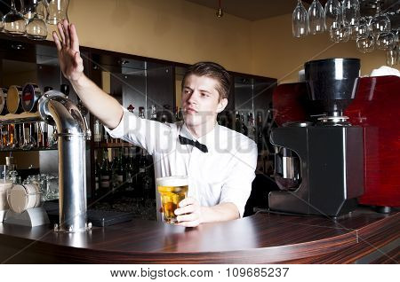 Young Handsome Bartender Waiting An Order.