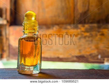 Camphor oil is placed on the window sill background.