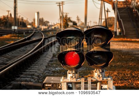 Traffic light shows red signal on railway