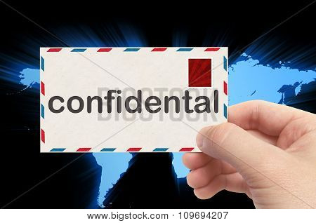 Hand Holding Envelope With Confidental Word And World Background