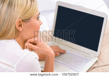 Young female tourist with her laptop.