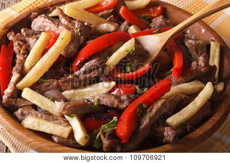 Peruvian Cuisine: Lomo Saltado Close-up On A Plate. Horizontal