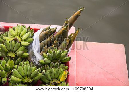 banana and bamboo shoot on boat